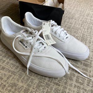 White Adidas skateboarding sneakers